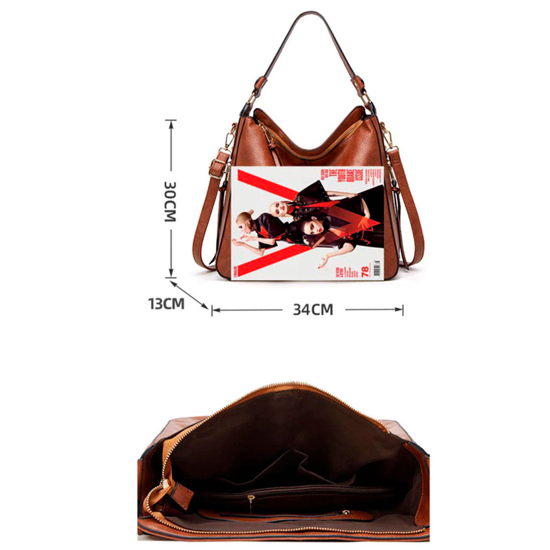 Bolsa de couro feminina com alça dupla, zíper seguro e design elegante. Modelo versátil, disponível em preto e caramelo, ideal para o dia a dia com estilo e sofisticação.