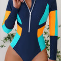 Maiô esportivo feminino com manga longa, zíper frontal e recortes em cores vibrantes. Design anatômico, ideal para esportes aquáticos, proteção solar e looks urbanos sofisticados.

