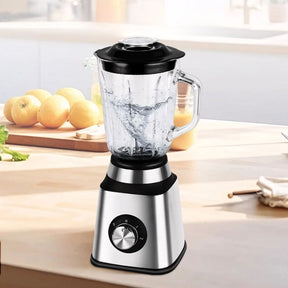 Liquidificador em aço inox com copo de vidro de 1,5L, 6 lâminas afiadas, botão giratório e função autolimpante. Acompanha jarra de moagem. Ideal para receitas, sucos e grãos.