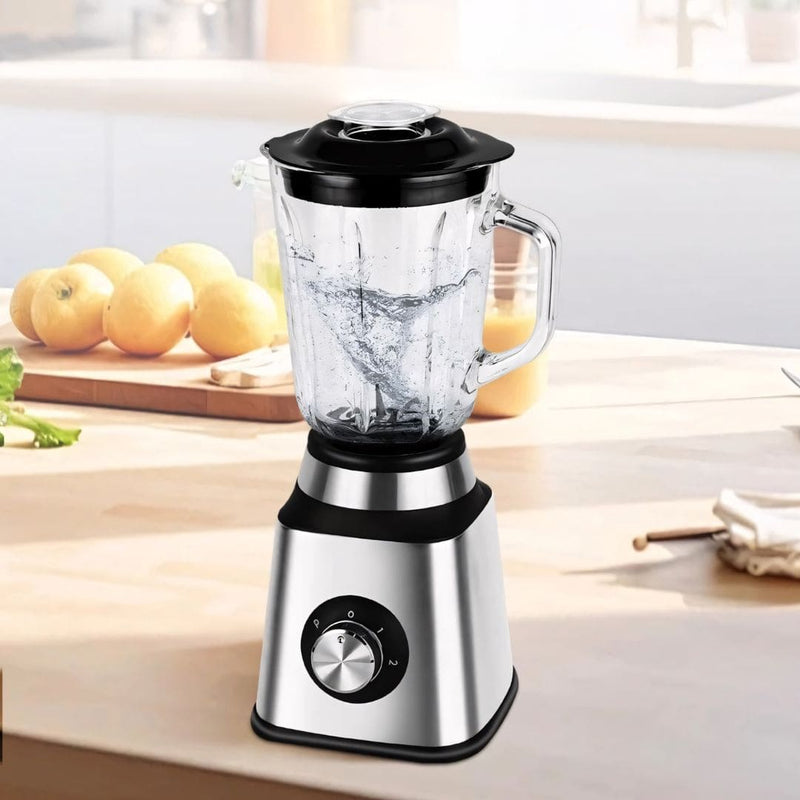Liquidificador em aço inox com copo de vidro de 1,5L, 6 lâminas afiadas, botão giratório e função autolimpante. Acompanha jarra de moagem. Ideal para receitas, sucos e grãos.