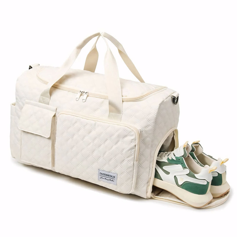 Mala de mão pequena para viagem com compartimento separado para calçados, acabamento acolchoado, alça tiracolo removível e múltiplos bolsos. Compacta e versátil.