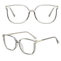 Óculos multifocal feminino com lentes transparentes, armação leve nas cores preta e marrom translúcida. Modelo com proteção contra luz azul e design sofisticado para uso diário.