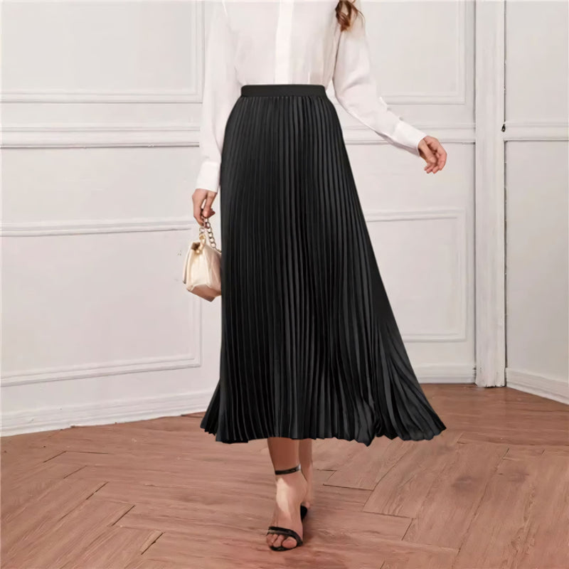 Saia midi feminina com plissado fino, disponível em cores neutras e vibrantes. Tecido leve e cintura elástica oferecem conforto, movimento e estilo para o dia a dia ou ocasiões especiais.