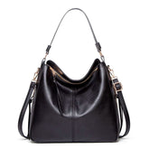 Bolsa de couro feminina com alça dupla, zíper seguro e design elegante. Modelo versátil, disponível em preto e caramelo, ideal para o dia a dia com estilo e sofisticação.
